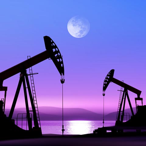 Working oil pump in deserted district in the bright of the moon